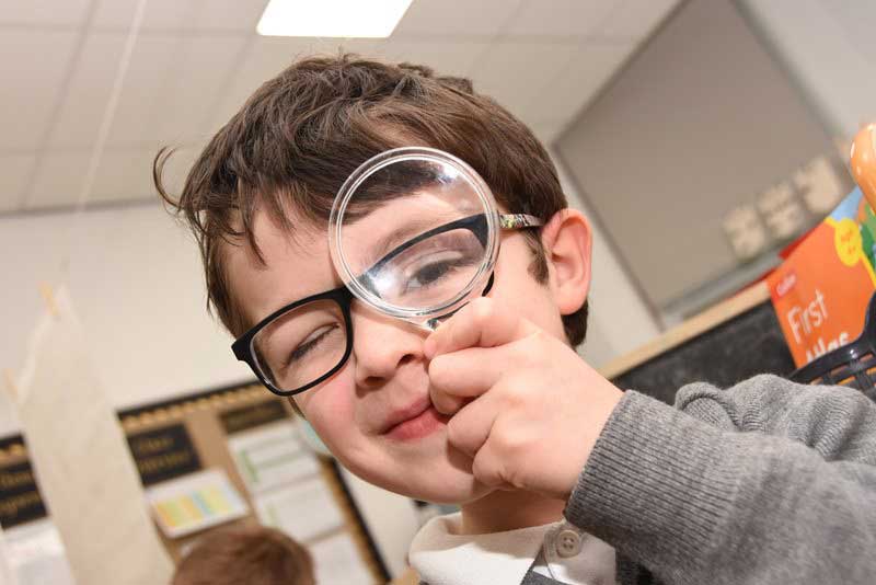 Boy with Magnifying Glass